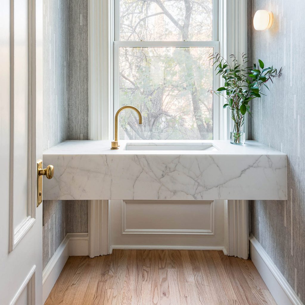 White marble sink in a window.